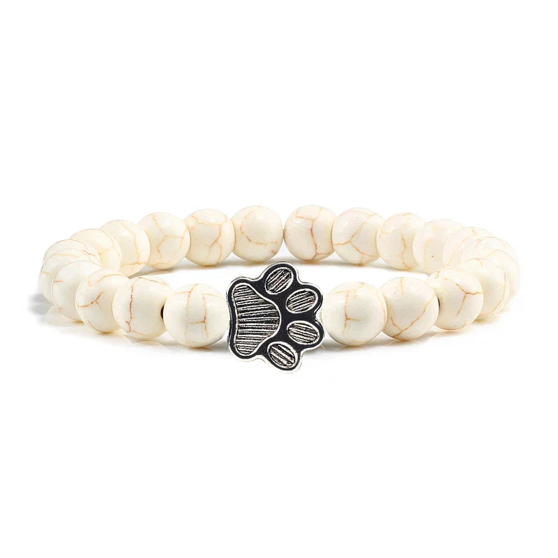 Margarida - Pulseira com estampa de patas decorada com miçangas.