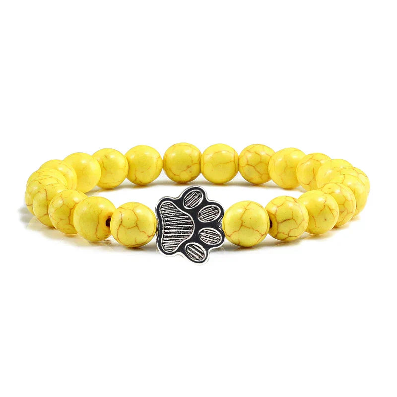 Margarida - Pulseira com estampa de patas decorada com miçangas.