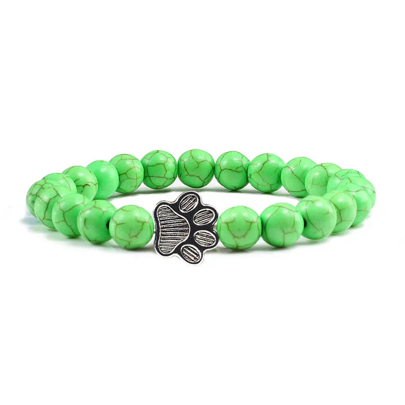 Margarida - Pulseira com estampa de patas decorada com miçangas.