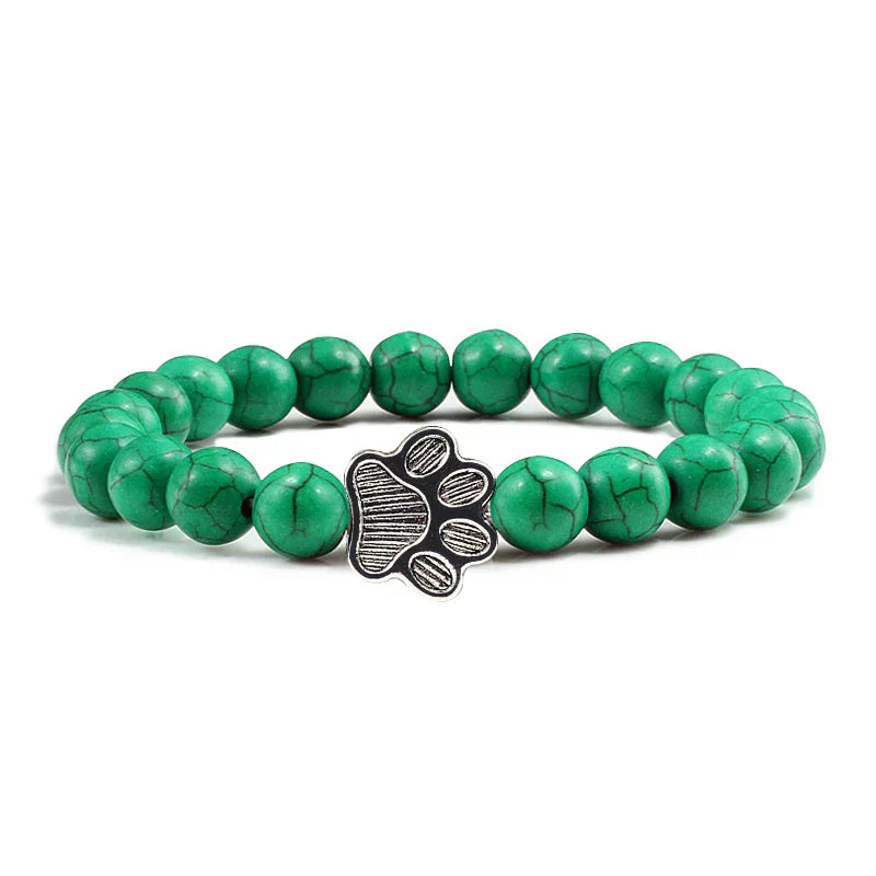 Margarida - Pulseira com estampa de patas decorada com miçangas.