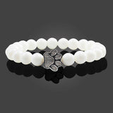 Margarida - Pulseira com estampa de patas decorada com miçangas.