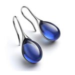 CristalLux Brincos Gota Ouro Prata - Elegância Brilhante - Ines Braga
