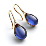 CristalLux Brincos Gota Ouro Prata - Elegância Brilhante - Ines Braga